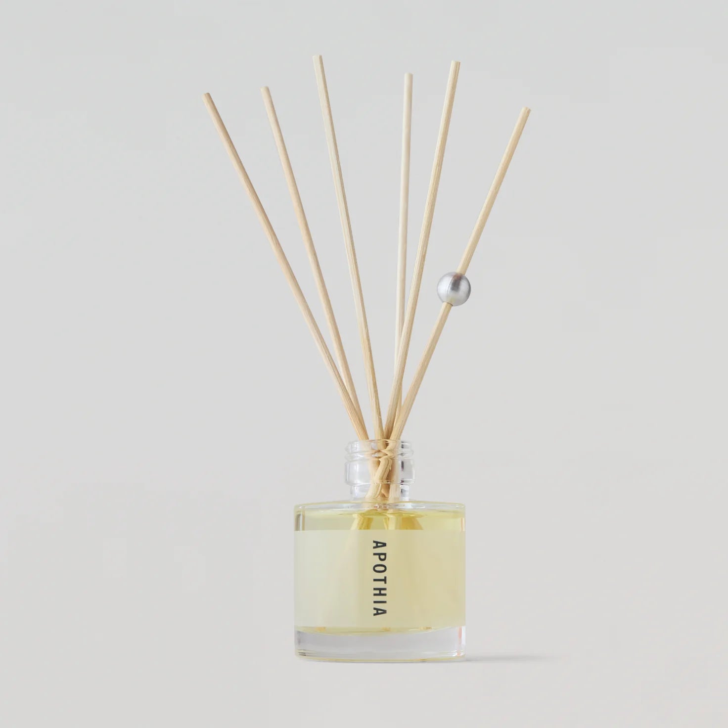 APOTHIA Wave Mini Diffuser with notes of white grapefruit, yuzu, seagrass, and salty ocean air.